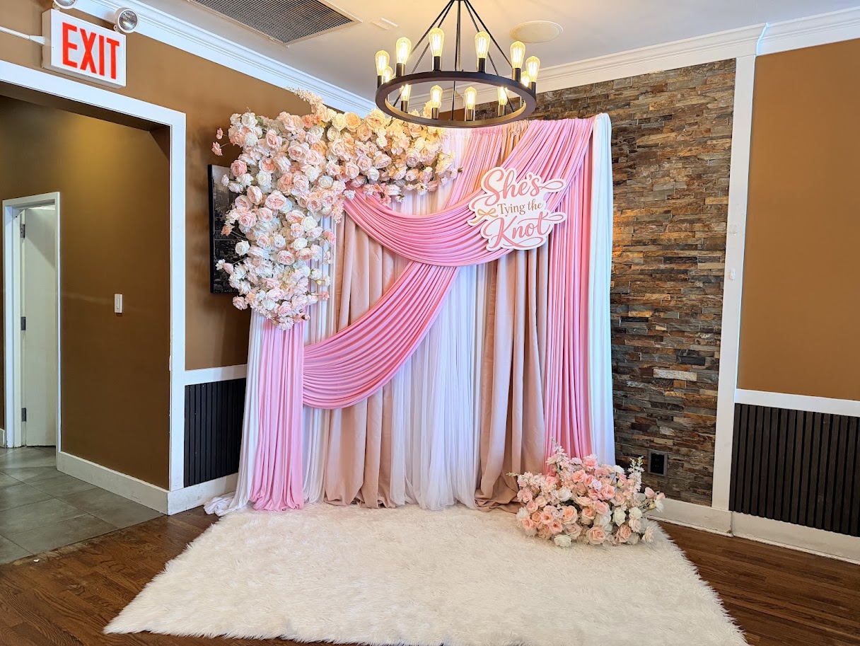 Head table draping with warm ambient lighting and delicate floral touches.