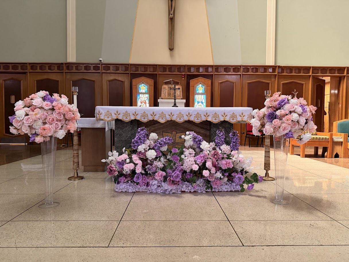 Head table draping with warm ambient lighting and delicate floral touches.