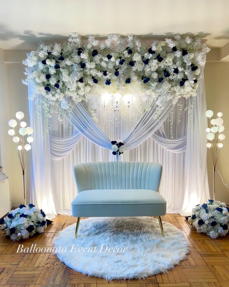 Head table draping with warm ambient lighting and delicate floral touches.
