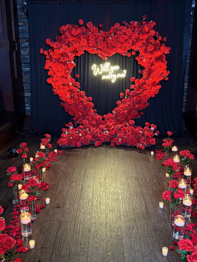 Head table draping with warm ambient lighting and delicate floral touches.