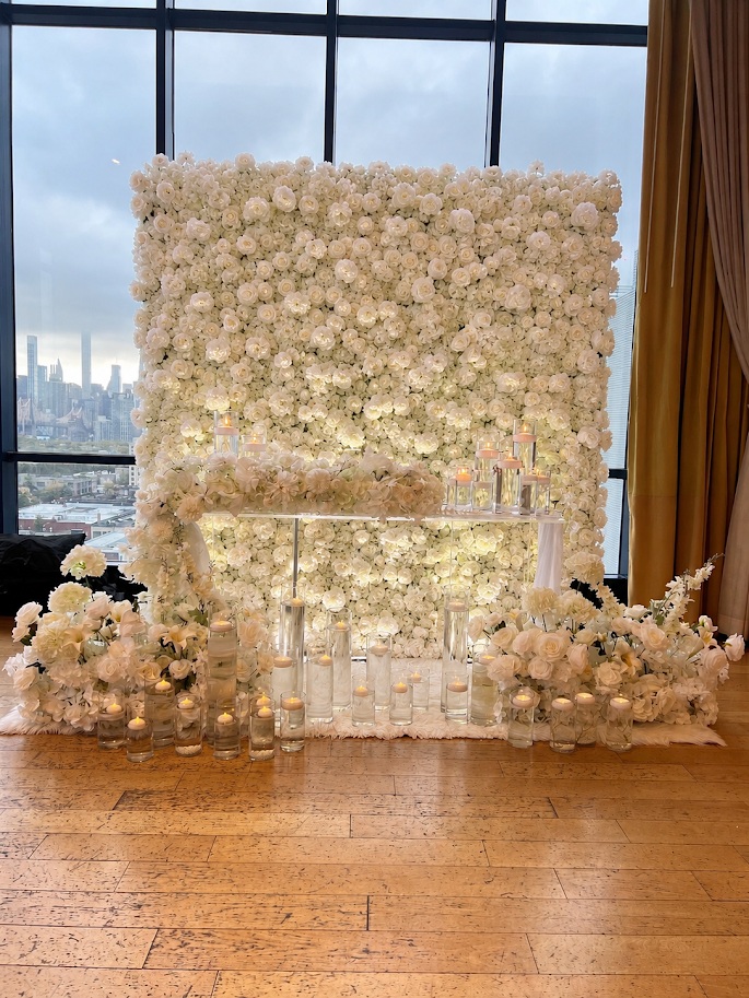Head table draping with warm ambient lighting and delicate floral touches.